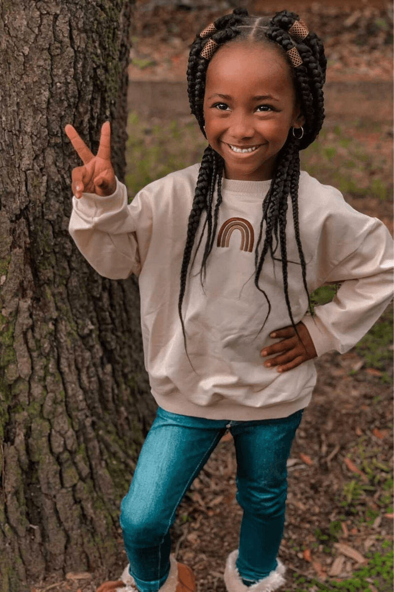 White and 2025 rainbow sweater